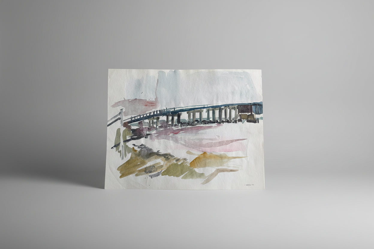 A piece of artwork featuring a bridge over water, painted with watercolor and ink on paper, displayed against a neutral background.