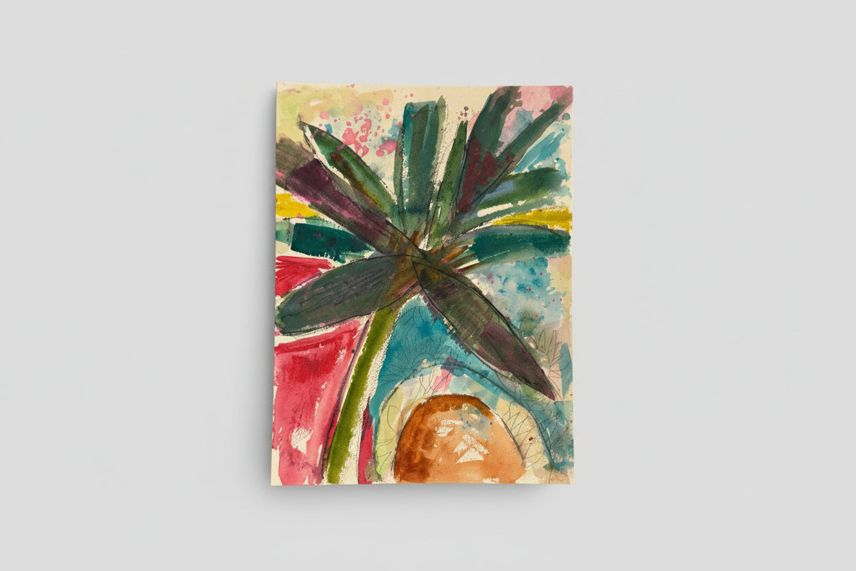 A mixed media artwork featuring a vibrant painting of palms and sun on a paper, displayed in a home setting with plants and a window in the background.