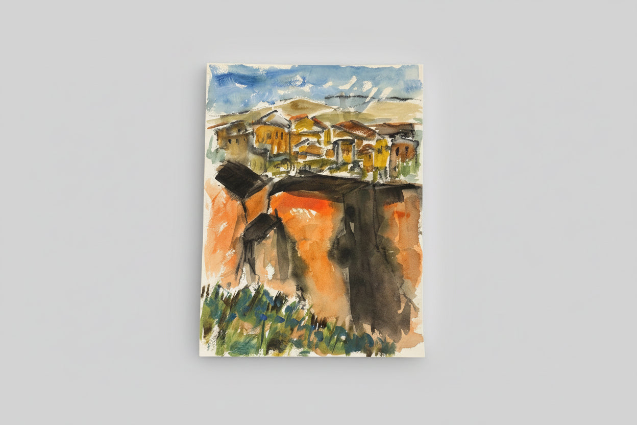 A framed mixed media artwork depicting a village scene, with bold colors and expressive brushstrokes, displayed on a wall above a potted plant.