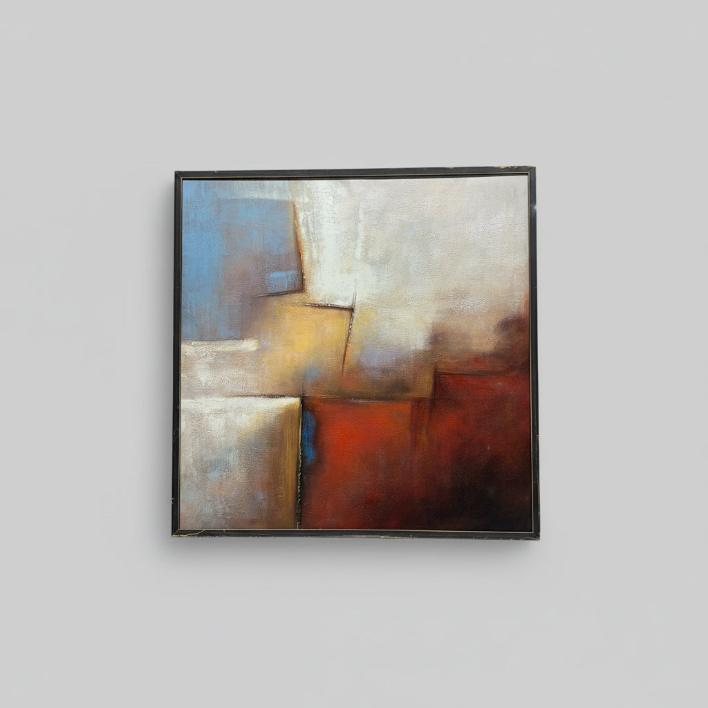 An abstract oil painting on canvas with predominantly red, blue, and beige colors, displayed in a custom frame, hanging on a wall.