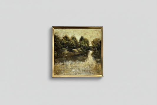 A framed oil painting on wood, depicting a lakeside scene, professionally hung on a wall.