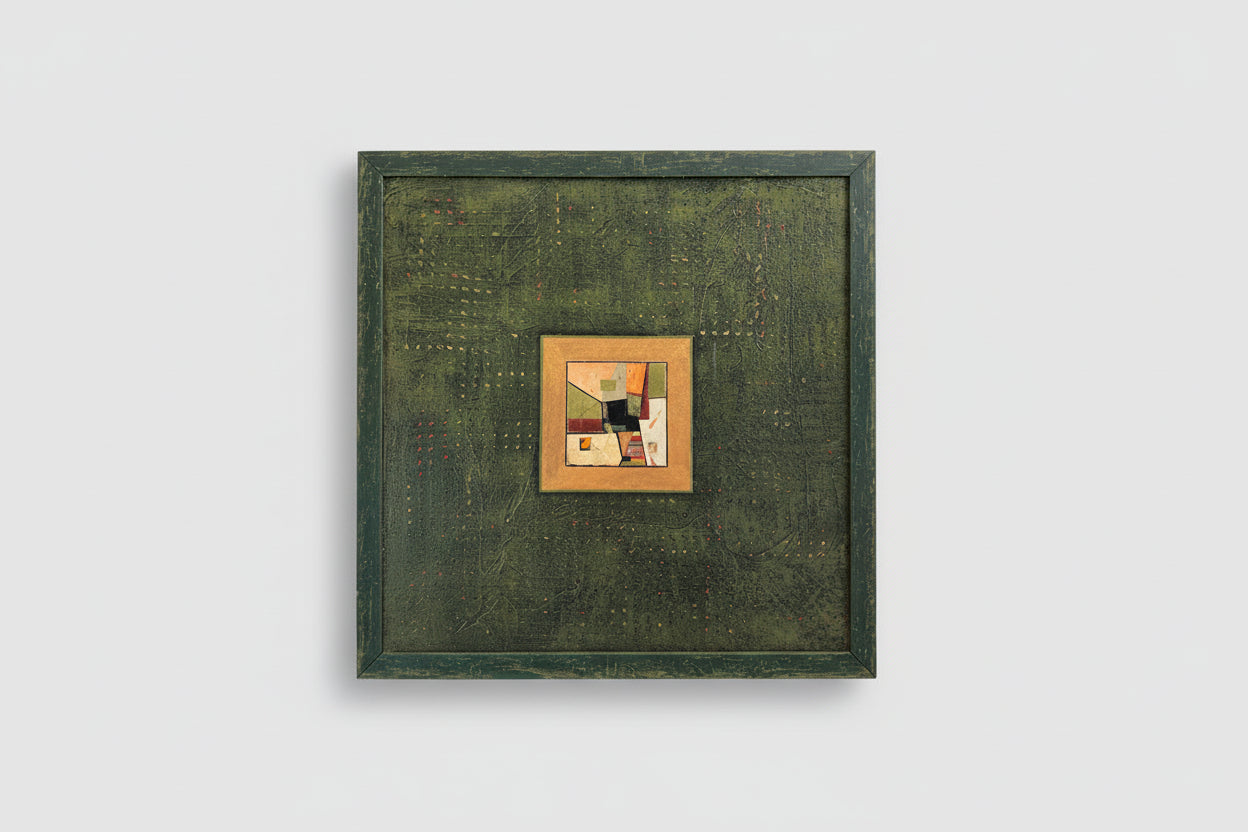 A custom distressed frame with a collage on board, hanging on a wall.