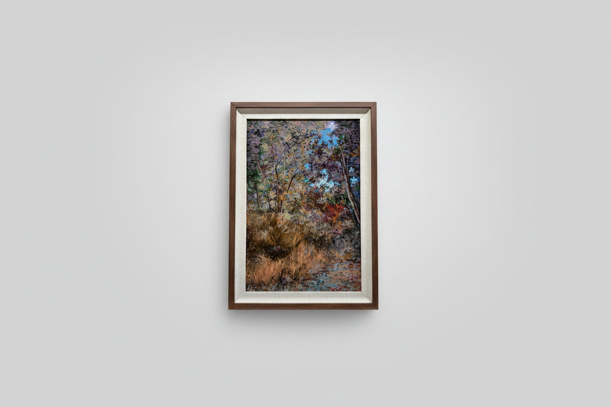 A framed artwork depicting a vibrant garden scene, hung on a wall above a windowsill with natural elements and a decorative frame.