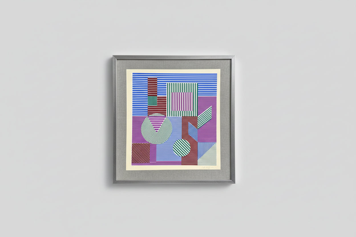 A limited edition screen print featuring geometric patterns in blue, purple, and red, framed in a gray wood frame, displayed on a wall.