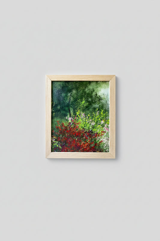 An oil on board painting titled 'The Garden Scene' depicting a vibrant garden with a custom wood frame, displayed on a wall.