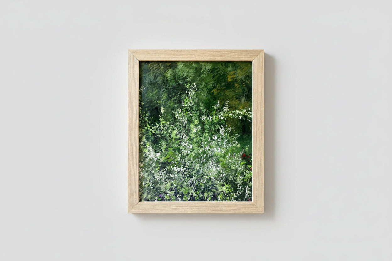 An oil on board painting titled 'The Garden Scene' displayed in a wooden frame, placed on a table with decorative items on both sides.