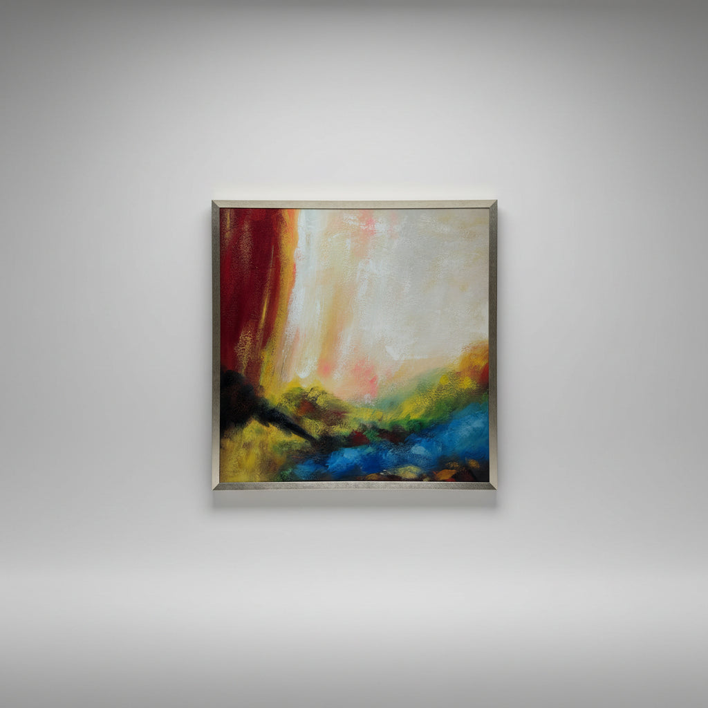 An abstract painting with vibrant colors, enclosed in a gold frame, hanging on a wall.