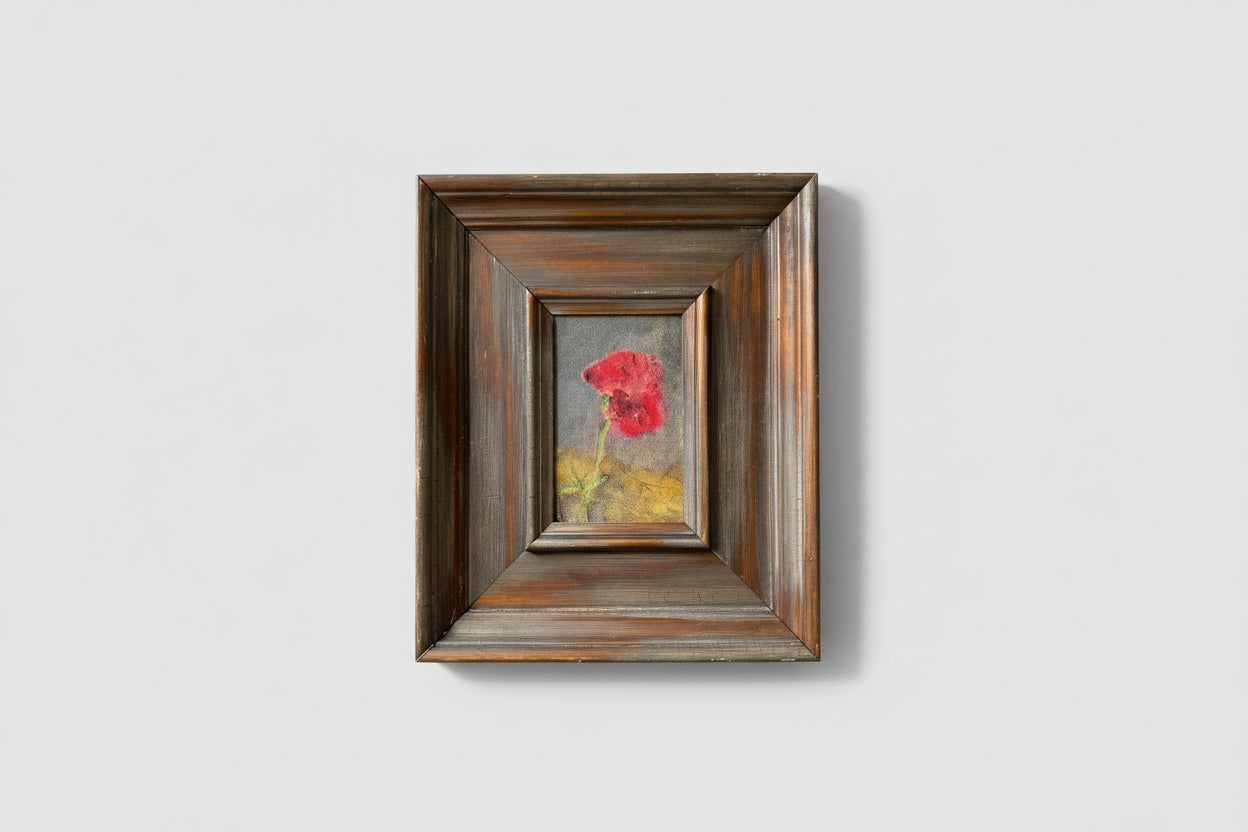 A framed oil painting on board depicting a floral subject, displayed on a wall.