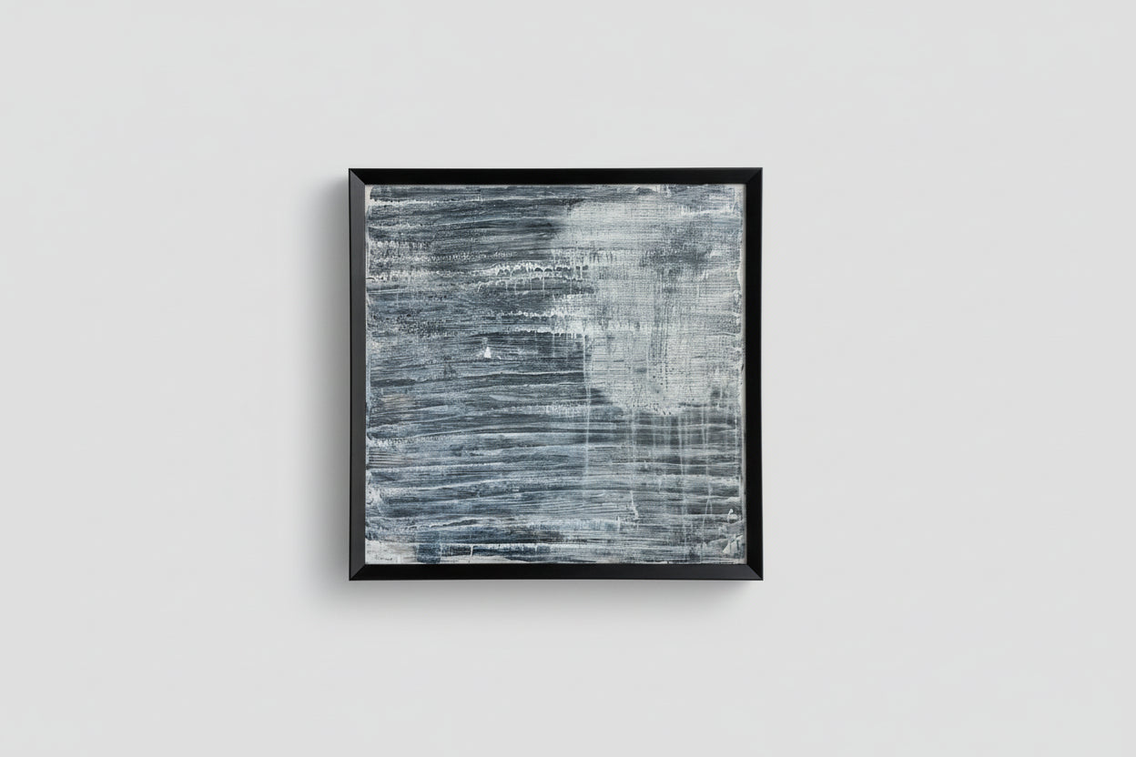 An acrylic on panel art piece with a reflective surface, framed in a black frame, displayed against a light background with natural lighting.