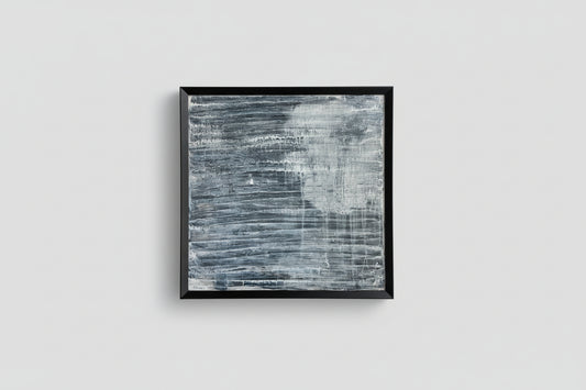An acrylic on panel art piece with a reflective surface, framed in a black frame, displayed against a light background with natural lighting.